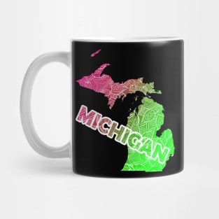 Colorful mandala art map of Michigan with text in pink and green Mug